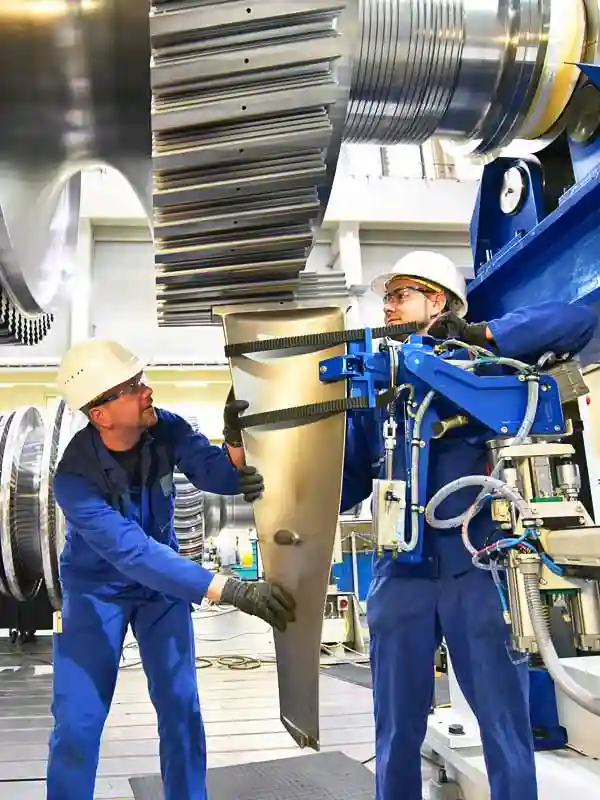Deux ouvriers sécurisent leur activité d'usine.